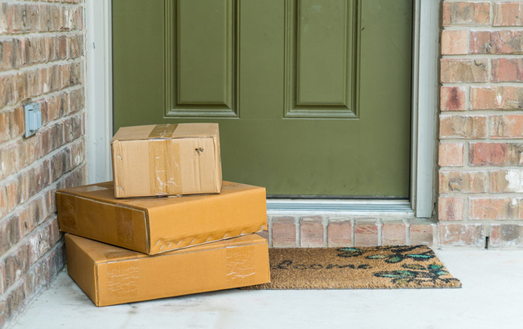 Packages sitting on a doorstop